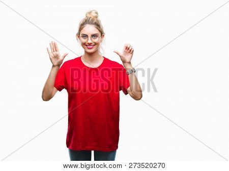 Young beautiful blonde woman wearing red t-shirt and glasses over isolated background showing and pointing up with fingers number six while smiling confident and happy.