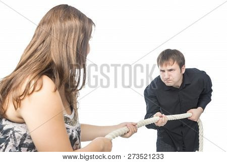 Portrait Of Young Caucasian Couple Towing A Rope To Each Other. Concept Of Separation And Divorce.ho