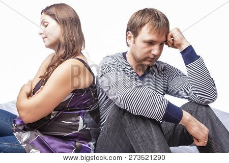 Concept Of Family Conflict. Young Caucasian Couple On Divorce Edge. Posing On White In Studio