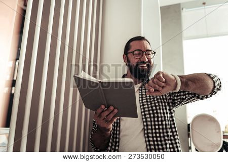 Cheerful Nice Man Looking At The Time
