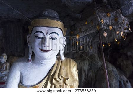 Horizontal Picture Of Beautiful Buddha Statue And Ornate Umbrella Inside Of Kaw Ka Thaung Cave, Loca
