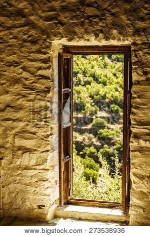 Door Frame Made Of Brown Wood. Old Construction, Ancient Architecture. Enterior Details.