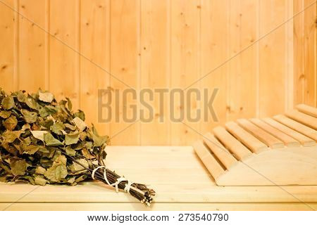 Russian Or Finnish Sauna Broom And Headrest In Wooden Sauna. Steam Bath With Broom Hot Steam