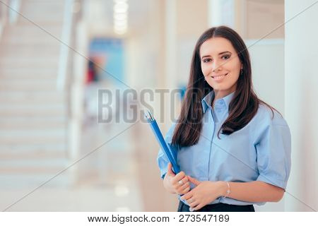 Professional Woman Holding Folder In Office Building