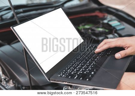 Close Up Engineer  Mechanic Using Electrnoic Diagnostic Equipment To Tune A Car, Laptop Blank Screen