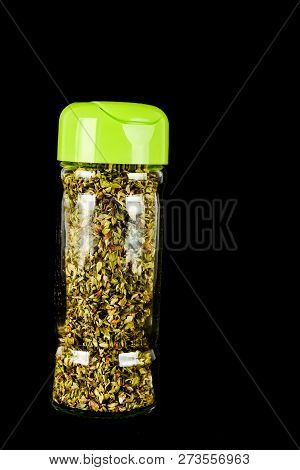 Close-up Of Oregan Spice Bottle Object On A Black Background