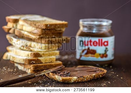 Simferopol, Ukraine - October 3, 2018: Sliced Of Marble Bread And Nutella Hazelnut Spread Jar On Rus