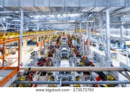 Vague Premise Of Assembly Line Production Of Cars. Defocused Image Of Car Factory