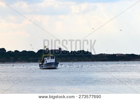 Fishing Boat Coming Back Home Harbor. Fishermen Come Back With Catch.