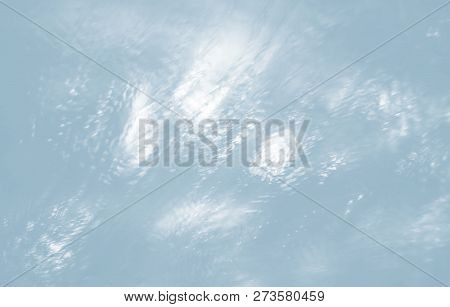 Abstract Water Grops Background. Water Drops And Splashing On Glass  Background Illuminated With Lig