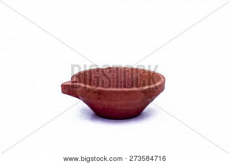 Close Up Of Lightening Lamps Or Diyas Or Divas Isolated On White Of Brown Color With A Swastik Or Sw