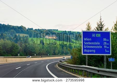 Wien, Austria - September 17, 2018: Sign Board In The Road Of Austria. Julian Alps On The Background