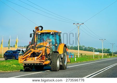 Maribor, Slovenia - September 19, 2018: Agricultural Tractor In The Highway Road In Slovenia.