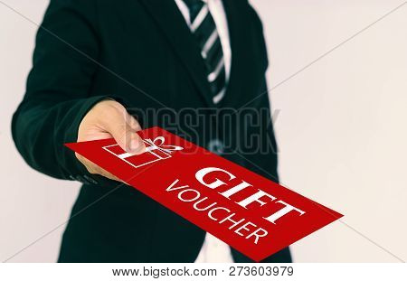 Gift Voucher Concept. Businessmen Send Red Gift Voucher Card.