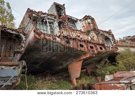 Huge Rusty Pieces Of Decommissioned Marine Ship That Was Cut And Left On The Shore.