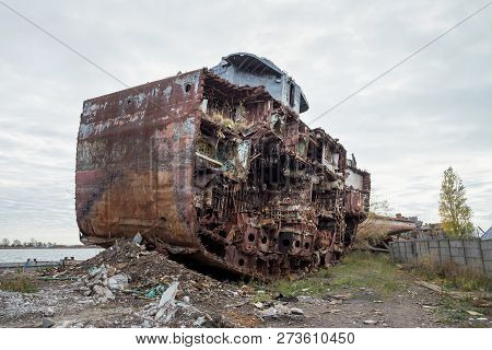 Huge Rusty Pieces Of Decommissioned Marine Ship That Was Cut And Left On The Shore.