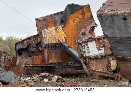 Huge Rusty Pieces Of Decommissioned Marine Ship That Was Cut And Left On The Shore.