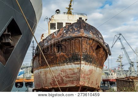 Rusty Decommissioned Marine Ship That Was Left On The Shore.