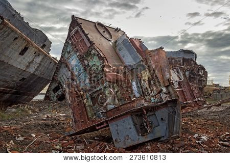 Huge Rusty Pieces Of Decommissioned Marine Ship That Was Cut And Left On The Shore.