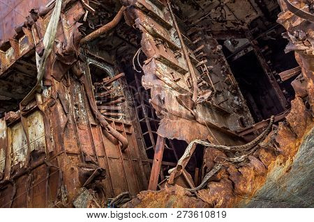 Huge Rusty Pieces Of Decommissioned Marine Ship That Was Cut And Left On The Shore.