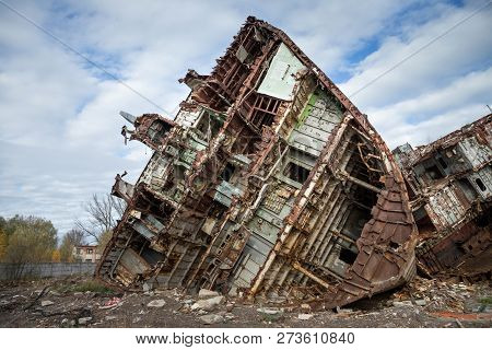 Huge Rusty Pieces Of Decommissioned Marine Ship That Was Cut And Left On The Shore.