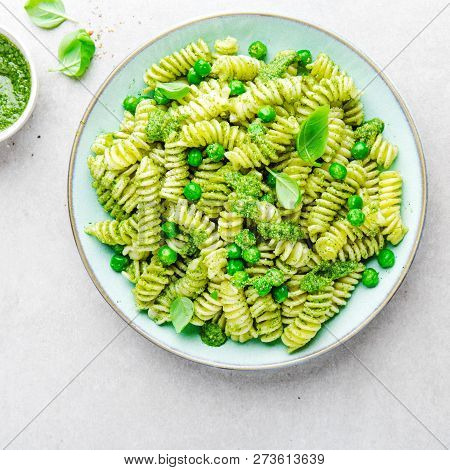 Tasty Appetizing Italian Pasta Al Bronzo With Pesto Sauce, Green Pea, Basil And Cheese Served On Pla