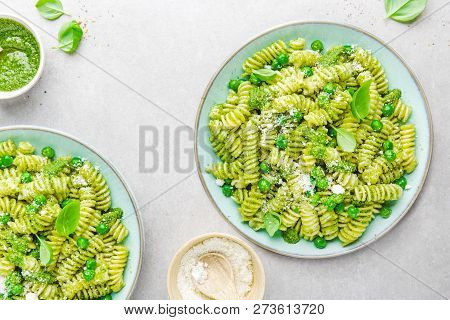 Tasty Appetizing Italian Pasta Al Bronzo With Pesto Sauce, Green Pea, Basil And Cheese Served On Pla