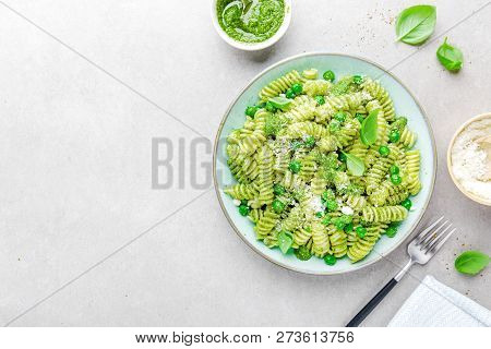Tasty Appetizing Italian Pasta Al Bronzo With Pesto Sauce, Green Pea, Basil And Cheese Served On Pla
