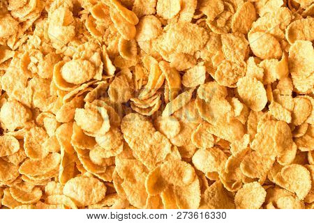 Background Texture Of Cornflakes. Top View. Corn-flakes