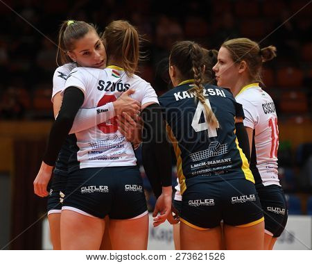 KAPOSVAR, HUNGARY â DECEMBER 2, 2018: Kaposvar players celebrate at a Hungarian National Championship volleyball game between Kaposvar (white) and Palota VSN (blue) in Sportcsarnok Kaposvar.