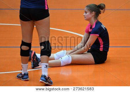 KAPOSVAR, HUNGARY â DECEMBER 2, 2018: Zsofia Meszaros sitting the field at a Hungarian National Championship volleyball game between Kaposvar (white) and Palota VSN (blue) in Sportcsarnok Kaposvar.