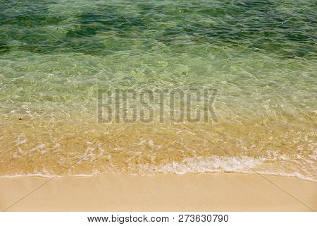 Beautiful Turquoise Sea On White Sunny Sand