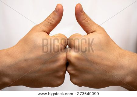 A Grown Man Shows A Sign Of Hand To Hand