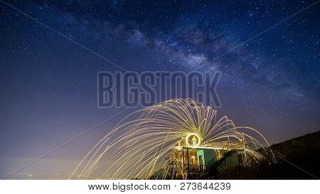 Night Landscape Mountain And Wield The Fire , Milkyway Galaxy Background , Long Exposure ,low Light
