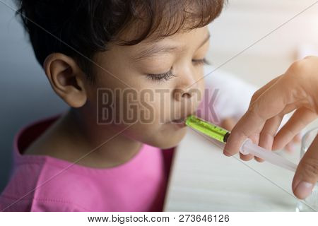 Sick Asian Kid Eat Medicine From Plastic Syringe