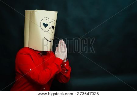 The Concept Of Emotions. The Girl In The Red Shirt Looks At The Interlocutor With Loving Eyes. On Th