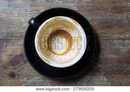 Empty Mug Of Coffee Latte On Vintage Wooden Table