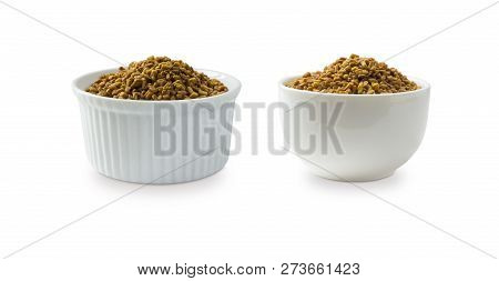 Fenugreek Seeds In A Wooden Bowl Isolated On White. Fenugreek Seeds Isolated On White Background. Fe
