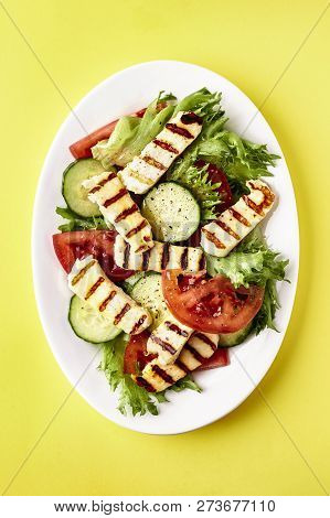 Plate Of Slad With Halloumi, Tomato And Cucumber
