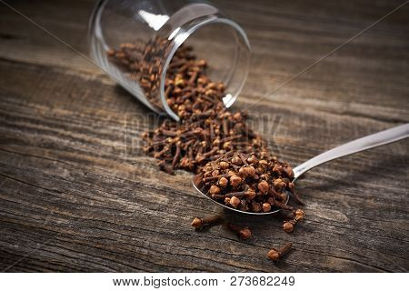 Dried Cloves  On A Gray Wooden Background