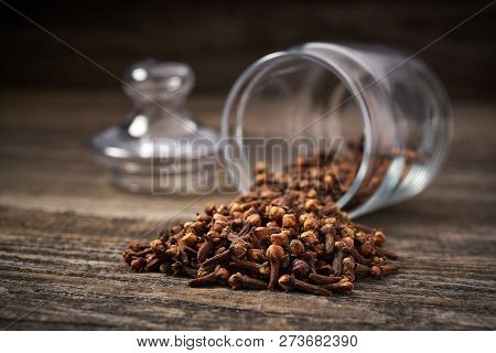 Dried Cloves  On A Gray Wooden Background
