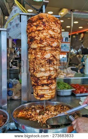 Istanbul Street Food Doner Kebab Made Of Meat Cooked On A Vertical Rotisserie. Traditional Turkish D