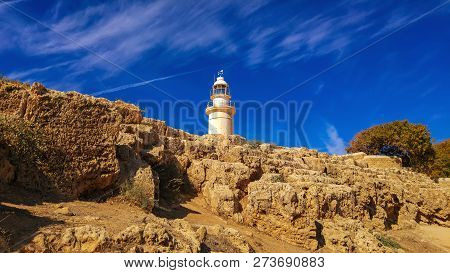 Ancient Ruins Of Kourion City Near Pathos And Limassol, Cyprus. Lighthouse Under The Blue Sky. Trave