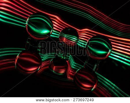 Light Painting With Photographic Light Gels Creates A Modern Anstract Christmas Ornament Look.