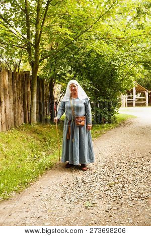 Sundby Lolland, Denmark - August 21, 2017 - The Senior Woman In Medieval Clothes In The Middle Ages 