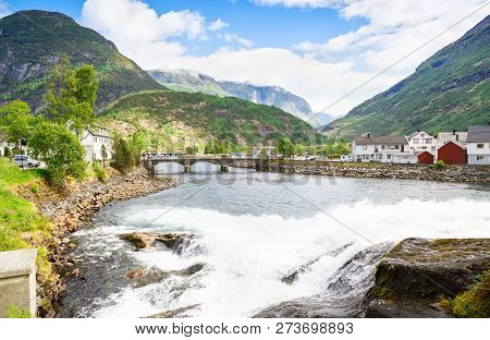 Landscape With Mountains, Houses, Bridge And River In Hellesylt, Norway.