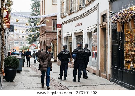 Strasbourg, France - Dec 11, 2018: Rear View Of French Police Officers Securing Rue De Loutre City C
