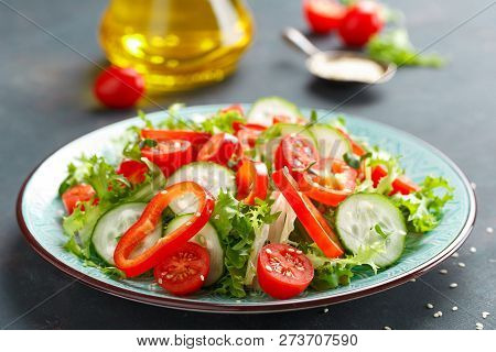 Healthy Vegetarian Vegetable Salad Of Fresh Lettuce, Cucumber, Sweet Pepper And Tomatoes. Vegan Plan