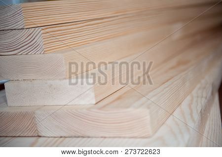 Wood Boards. Timber In Stock. Many New Boards In Stock. Planed Boards Are Stacked.