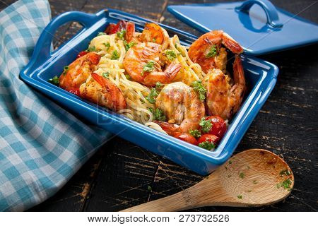 Stir-fried Spaghetti With Grilled Shrimps And Tomatoes - Italian Fusion Food Style.
